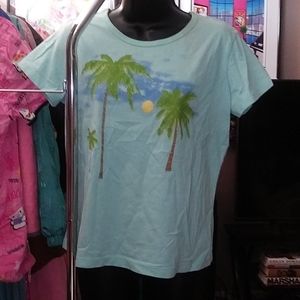 Turquoise T-shirt with palm trees backed by a moon